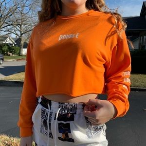 Neon orange cropped long sleeve shirt